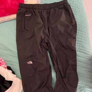 Black North Face waterproof wind pants.